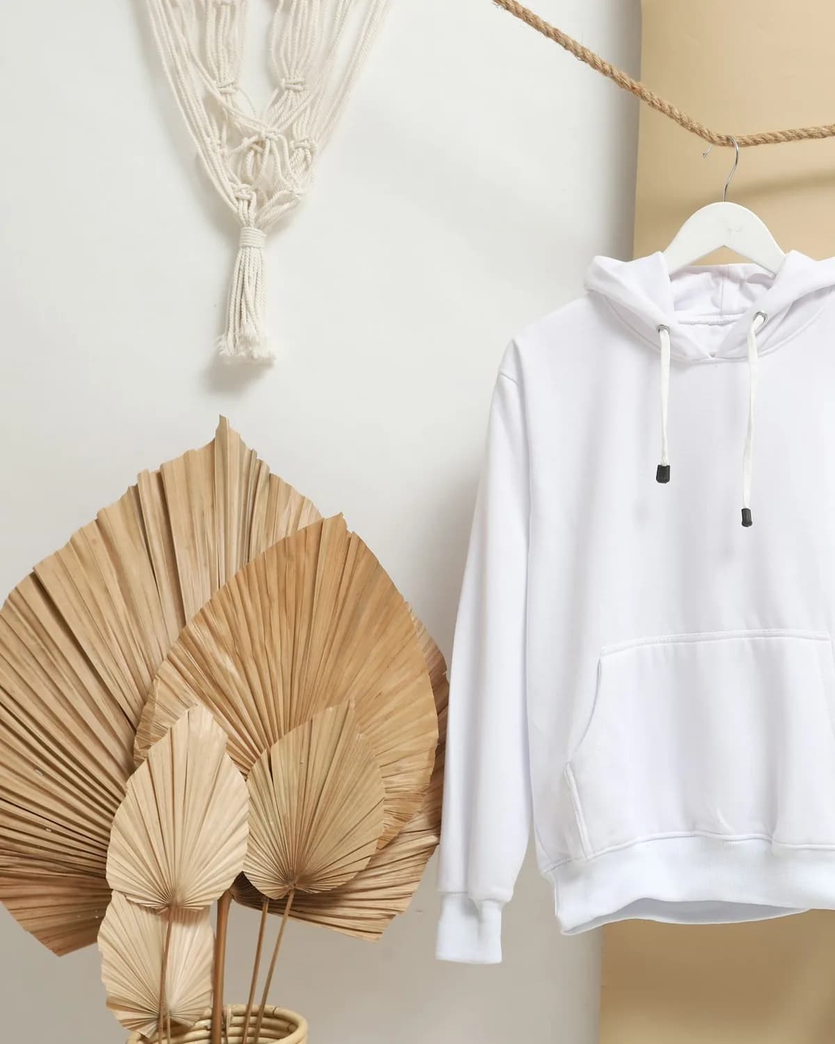 White hoodie on a hanger
