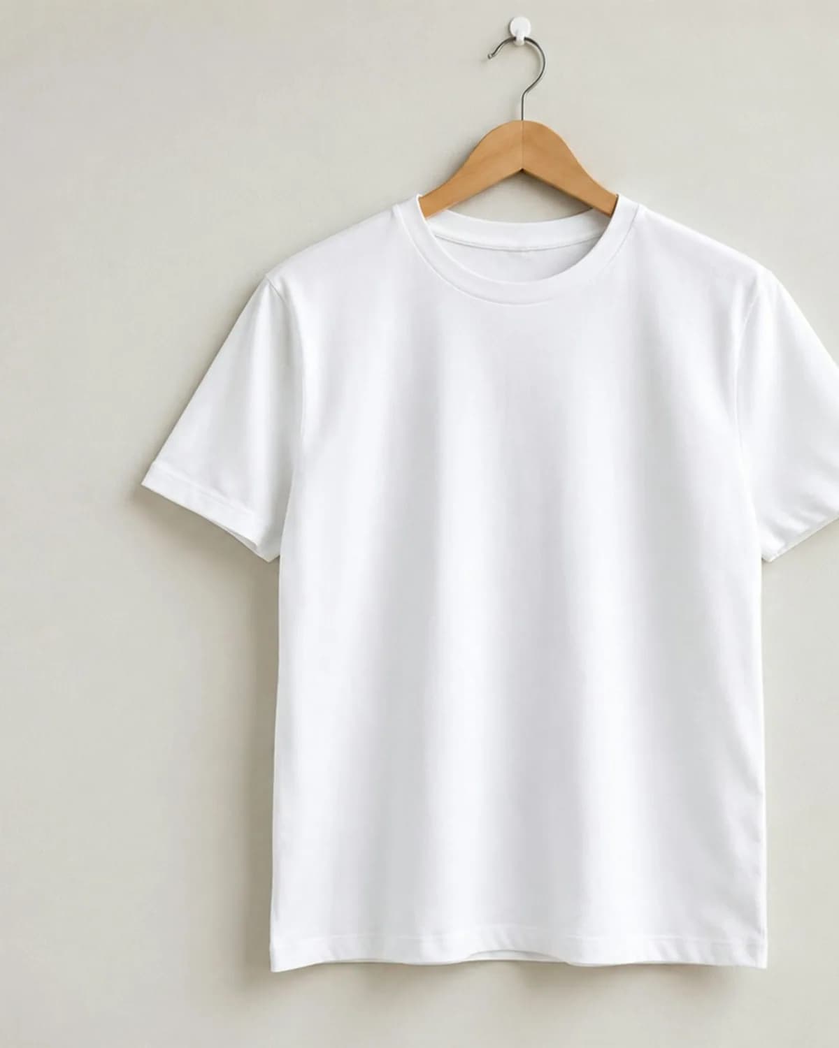 White tee on a wooden hanger